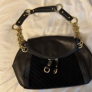 Medium size black leather handbag